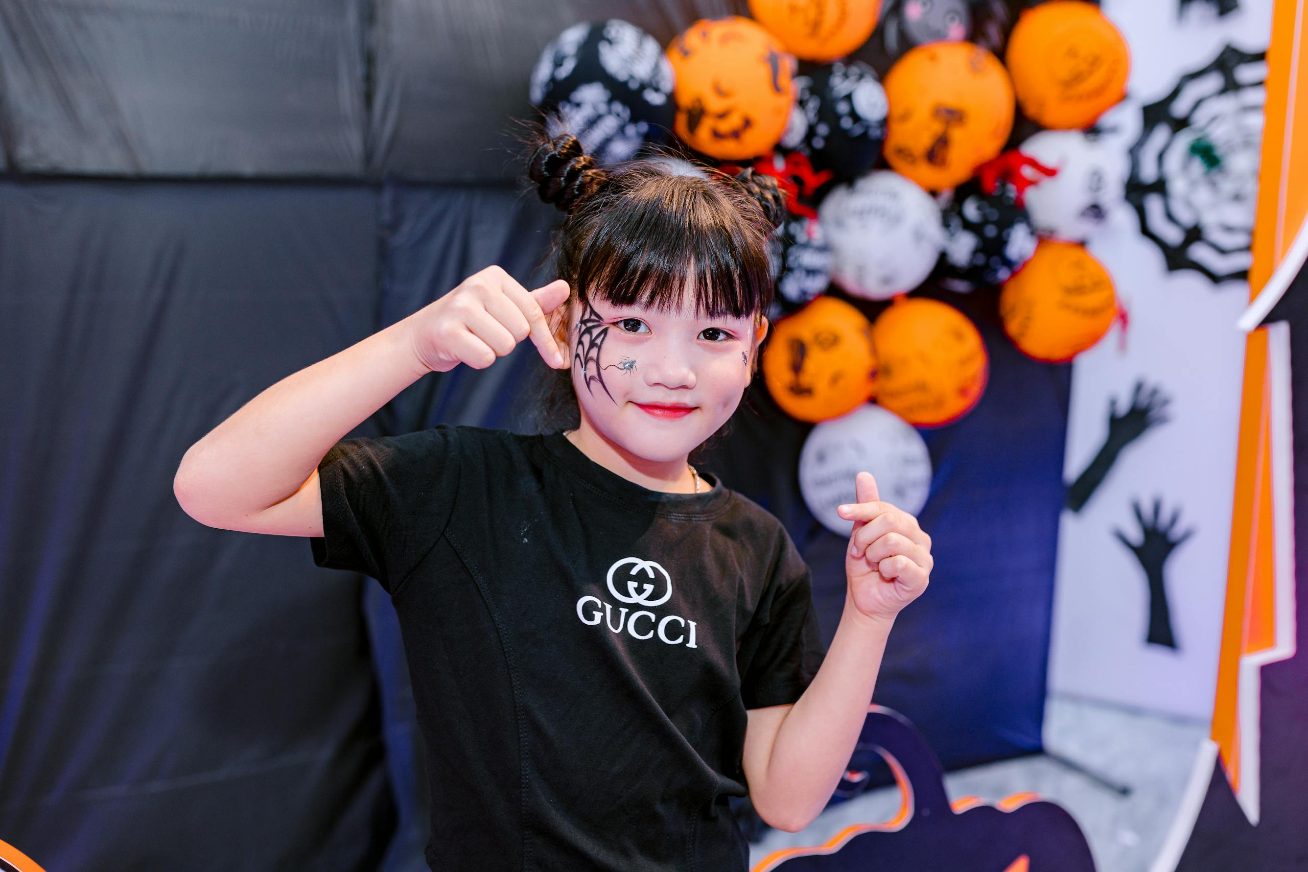 Young girl with Halloween balloons